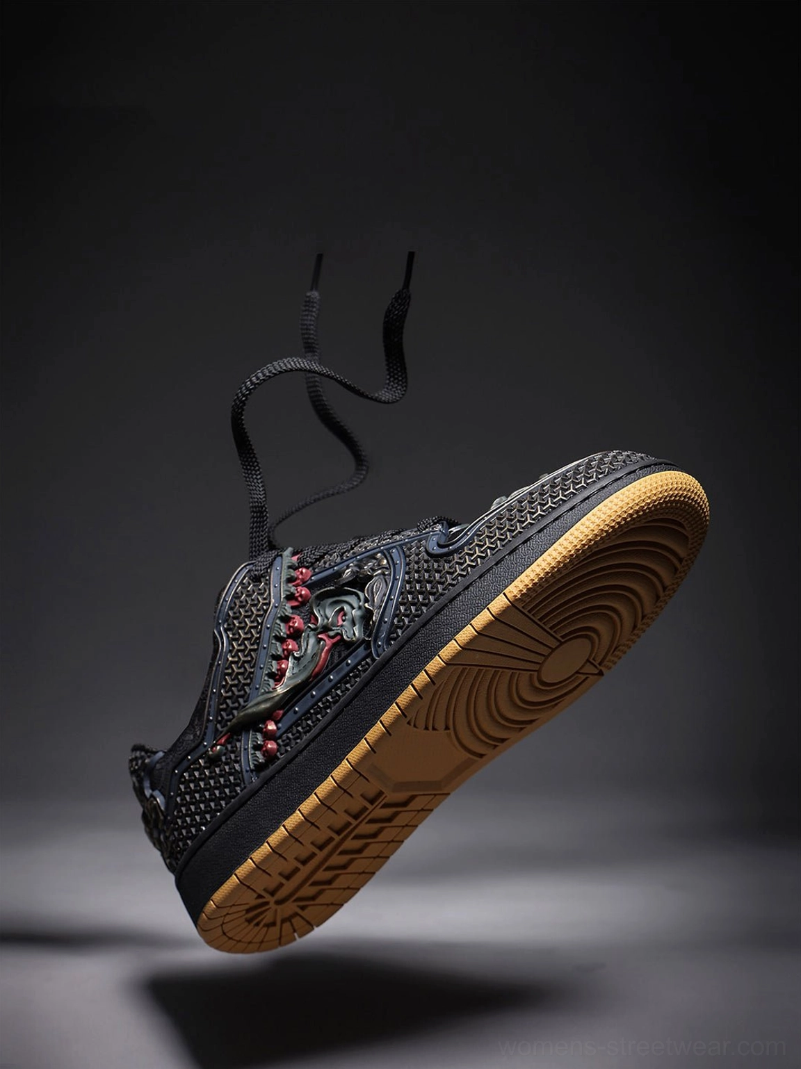 East Asian inspired black dragon sneakers with bold embroidered detailing and a streamlined low-top streetwear profile