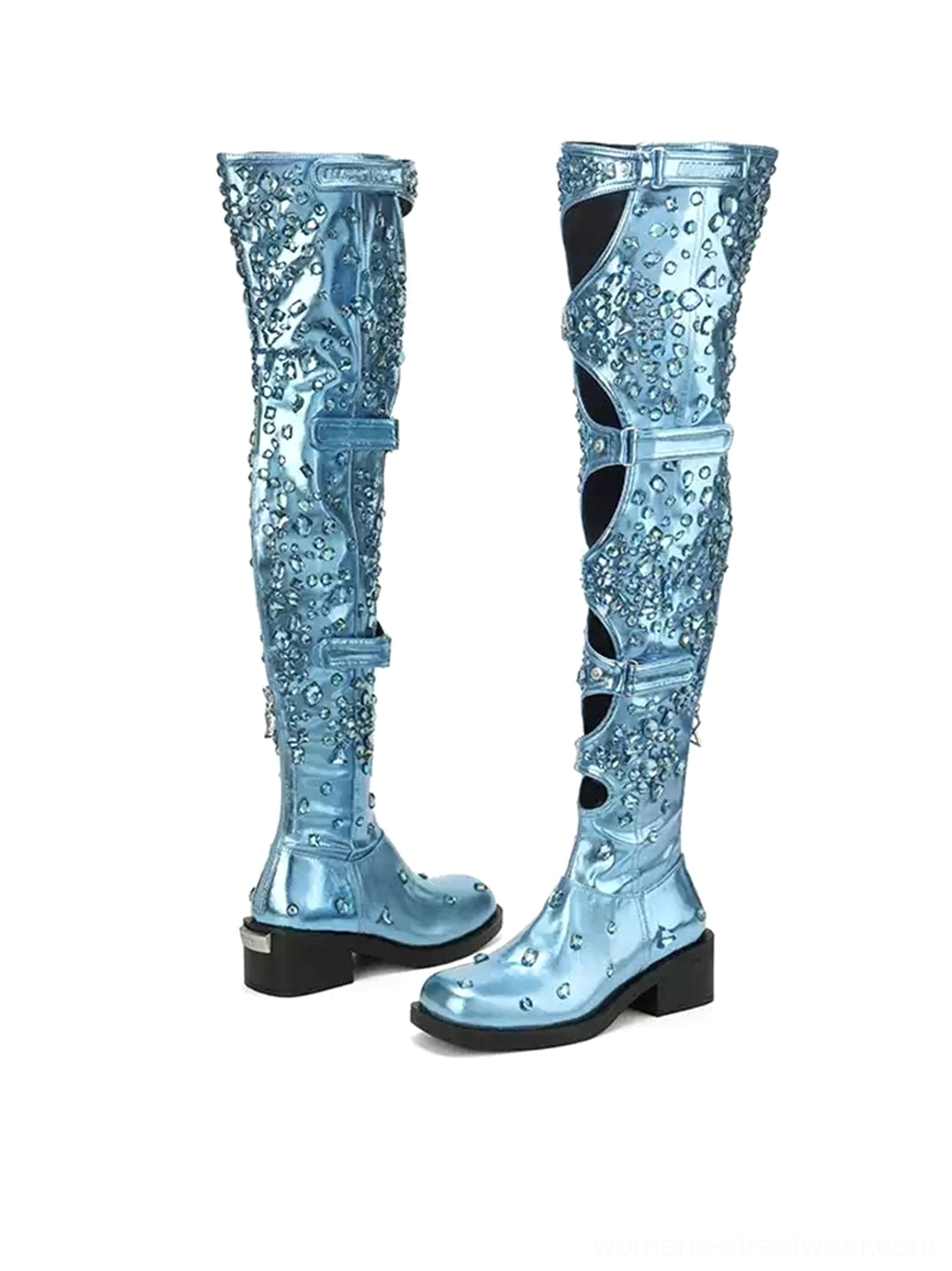 Side view of electric blue over-the-knee boots with metallic studded texture, shaft cutouts, buckle straps, and block heels