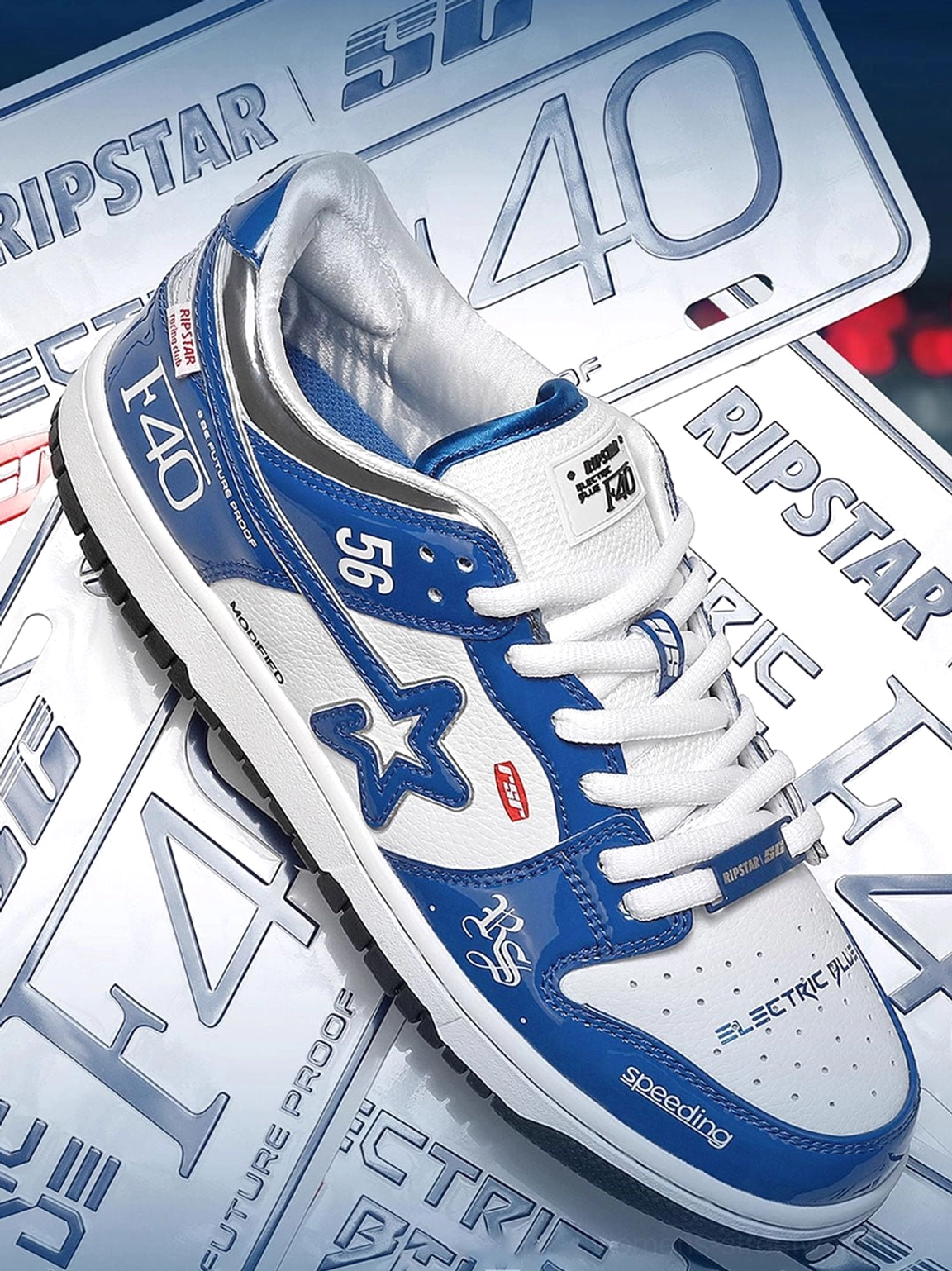 Pair of electric blue retro racing skate sneakers shown from an angled top view with star graphics, number 56, racing prints, and thick anti-slip outsole