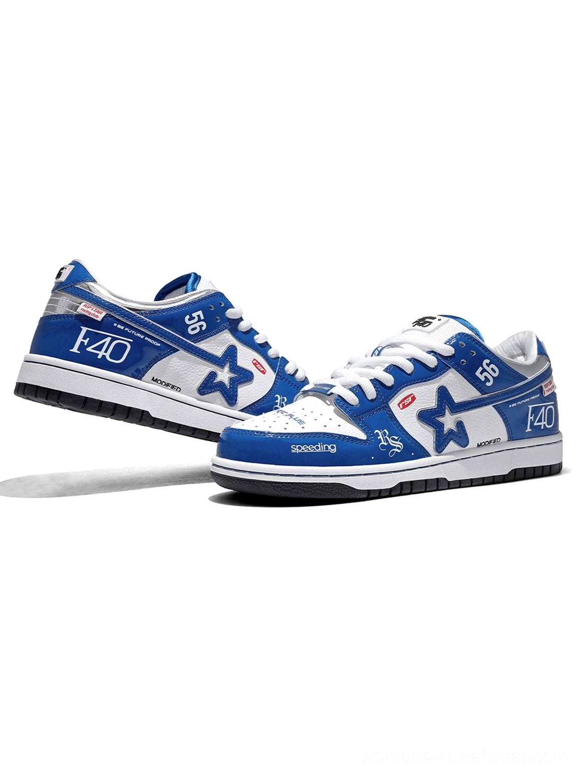 Angled rear view of electric blue retro skate sneakers with racing graphics, star details, silver accents, and two-tone black and white outsole