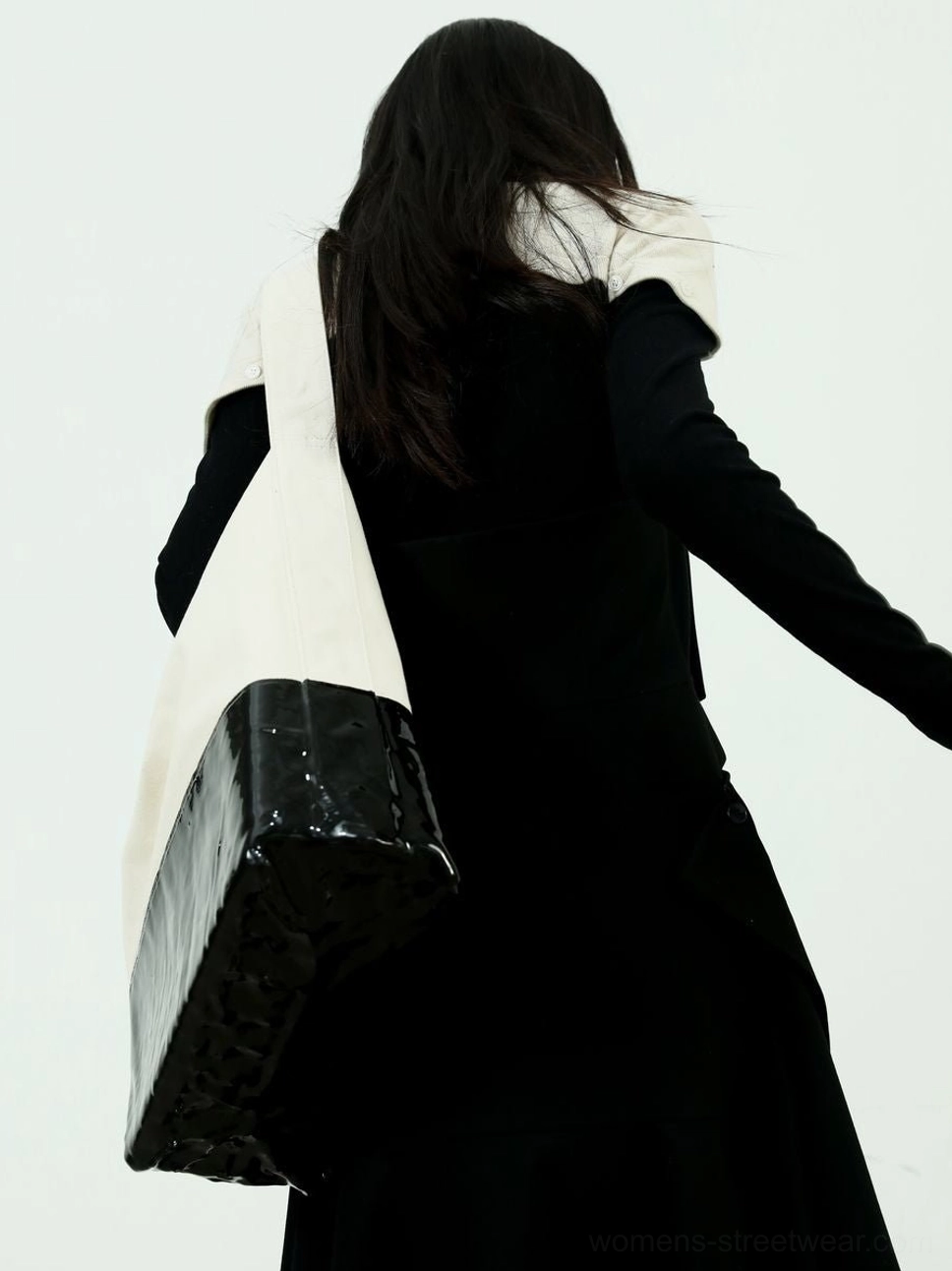 Rear full body view of Elevate two-tone high-neck knitwear in a minimalist Korean fashion styling