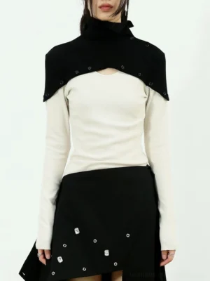 White and black two-tone high-neck layered knit top shown from the front in a Korean streetwear outfit