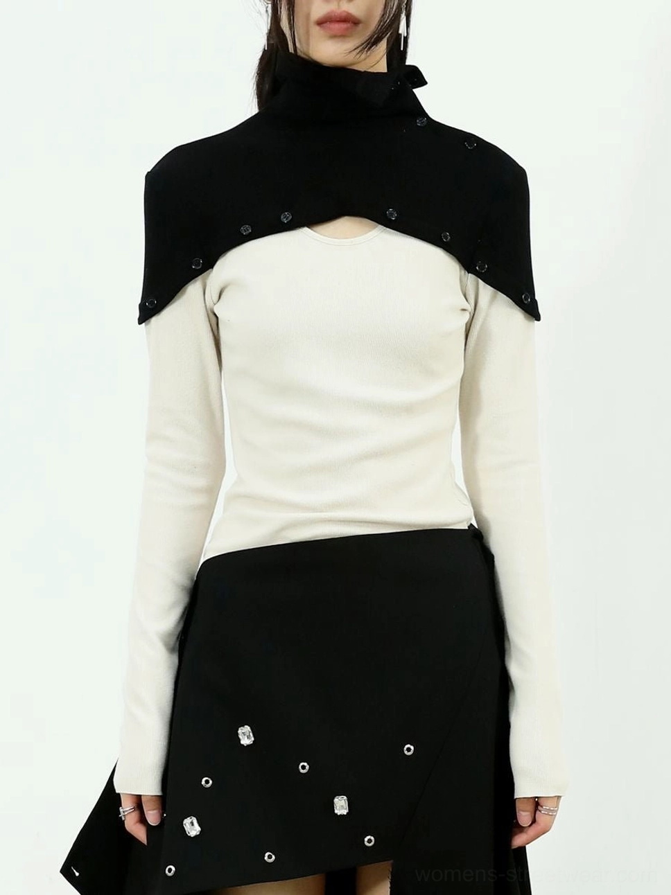 White and black two-tone high-neck layered knit top shown from the front in a Korean streetwear outfit