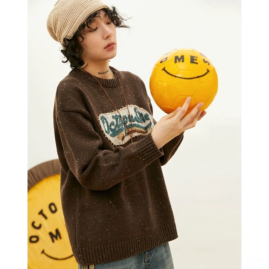 Embroidered patch oversized knit sweater in a vintage streetwear design with soft textured fabric, classic crewneck, and relaxed fit