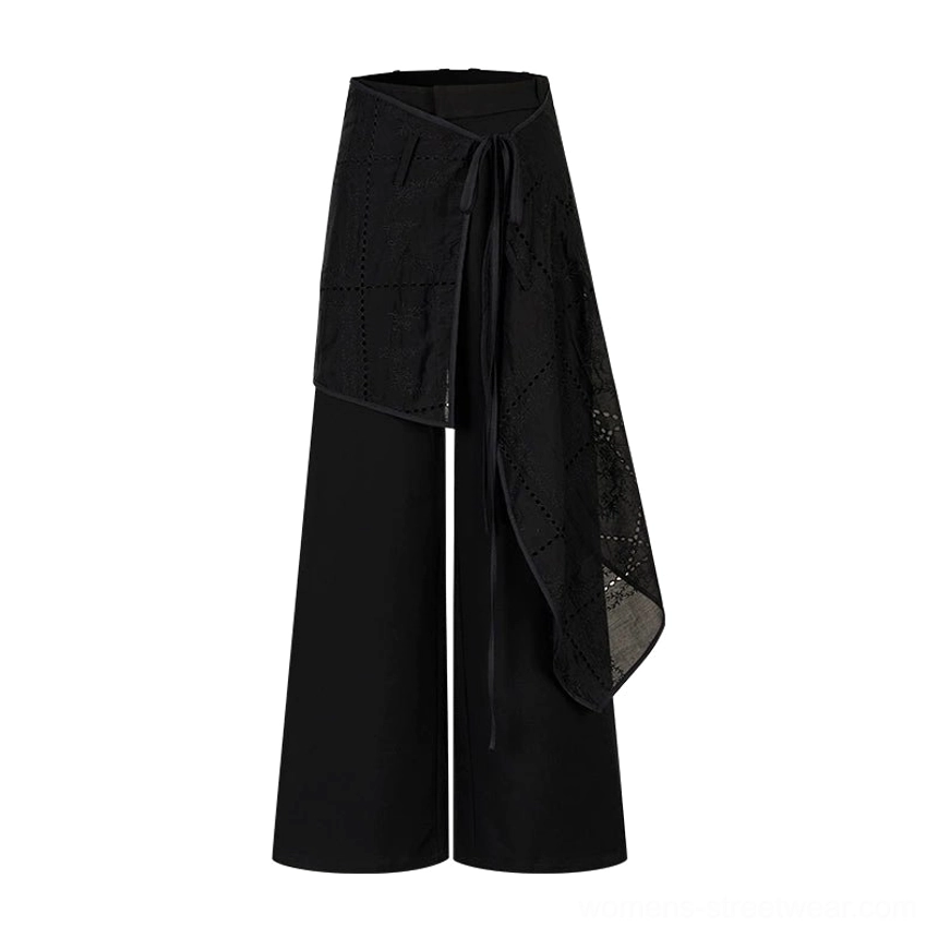 Black embroidered wrap skirt wide-leg streetwear trousers with asymmetric overlay and high-waisted silhouette
