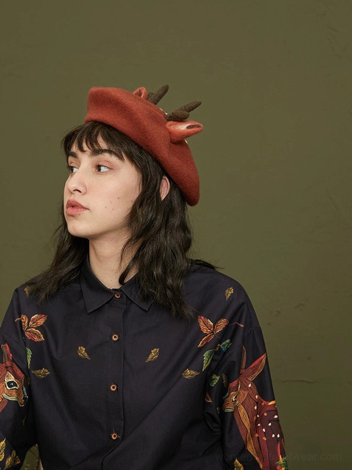 Close-up front view of enchanted forest deer print cotton blouse showing collar buttons and fawn foliage artwork