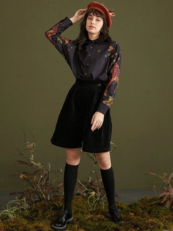 Full outfit view of enchanted forest deer print cotton blouse with black shorts knee socks and loafers