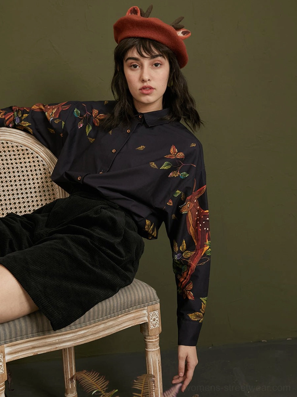 Enchanted forest deer print long-sleeve cotton button-up blouse styled with black corduroy shorts