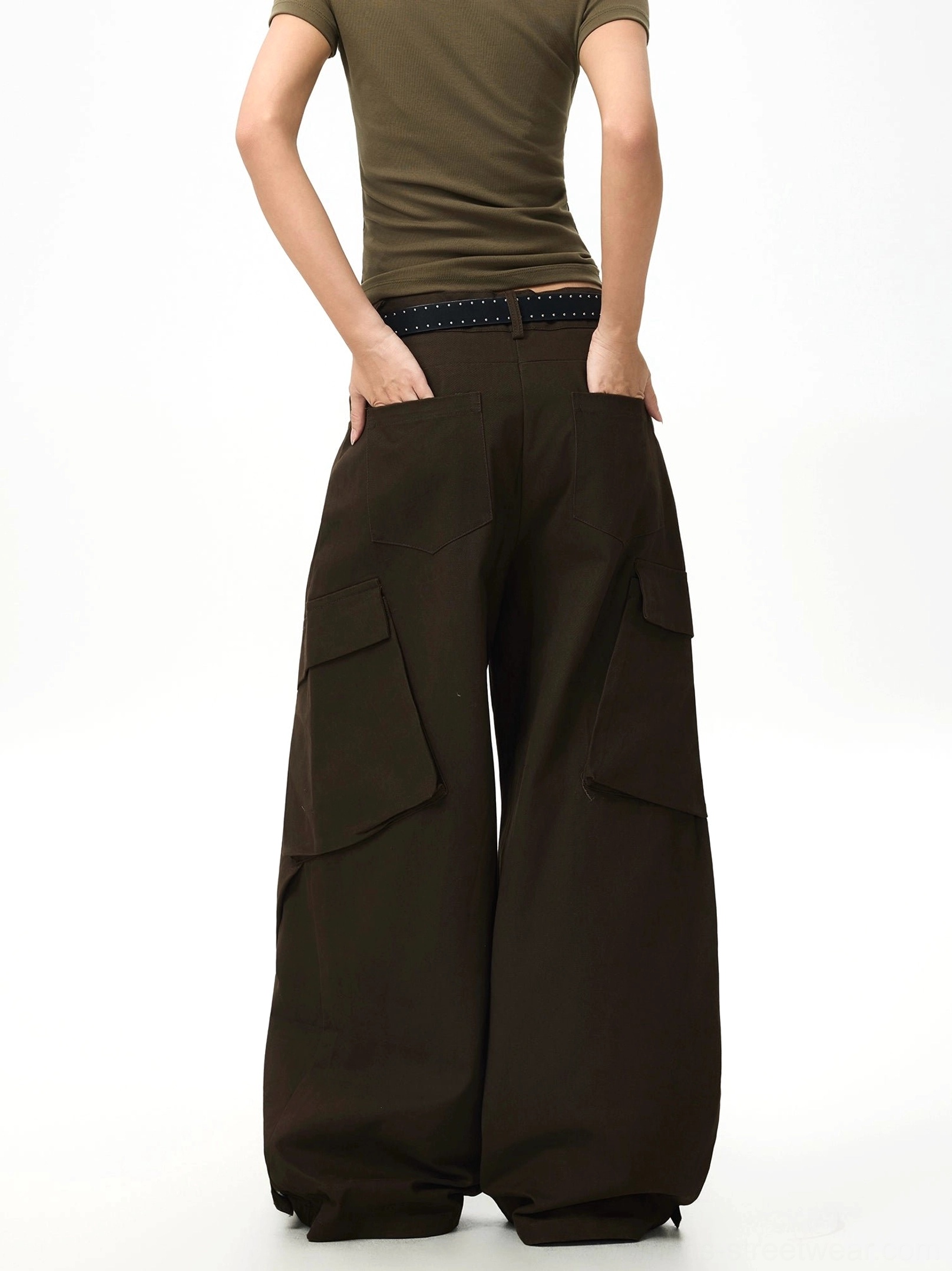 Back view of espresso brown wide-leg streetwear pants featuring structured rear cargo pockets and a clean dark finish