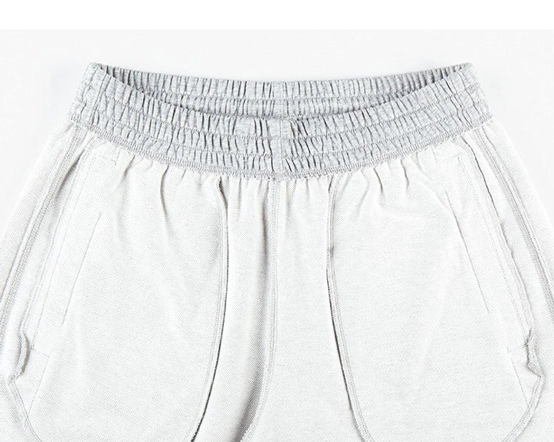 Essential streetwear cotton sweat shorts with relaxed fit, elastic waist, side pockets, and summer-ready comfort
