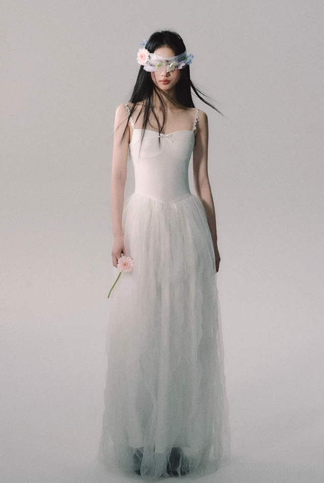 Ethereal white lace strap tulle gown combining romantic bridal details with contemporary Korean-inspired occasionwear