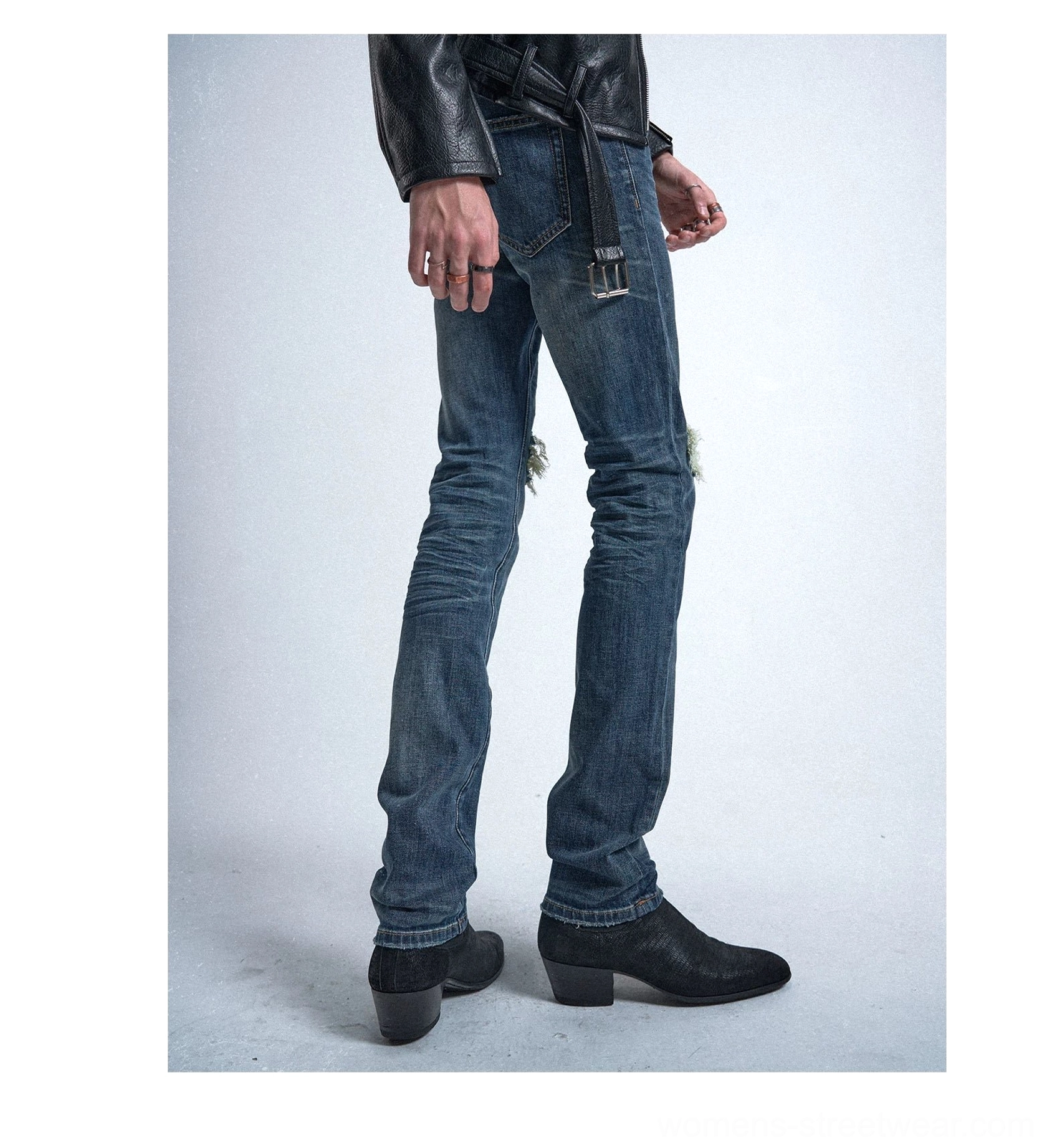 Rear three-quarter product view of faded vintage blue slim straight-leg jeans with leather-look belt loops and black ankle boots