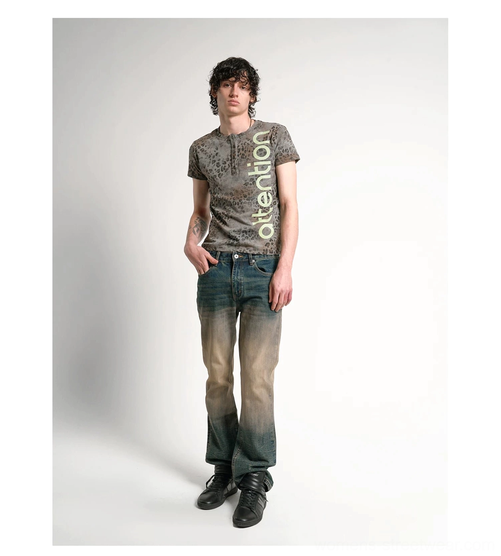 Faded leopard Henley tee with vertical attention graphic, short sleeves, stretch jersey fabric, and vintage streetwear styling