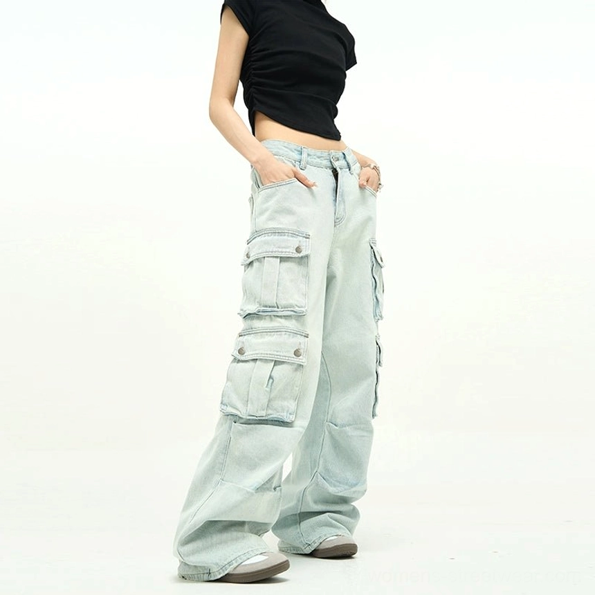 Faded light blue wide-leg cargo denim with oversized pockets, relaxed baggy fit, distressed seam details, and Seoul-inspired streetwear aesthetic