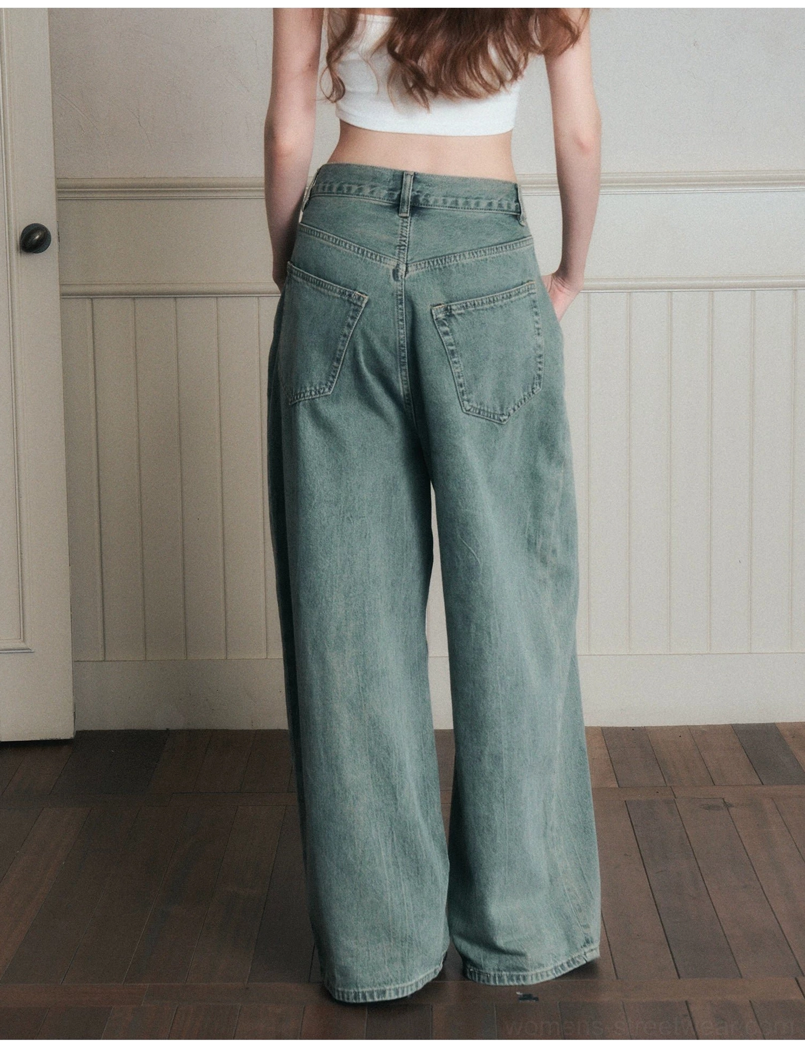 Back full-body view of faded sage blue wide-leg jeans with a floor-length hem, clean stitching, and relaxed Korean streetwear styling