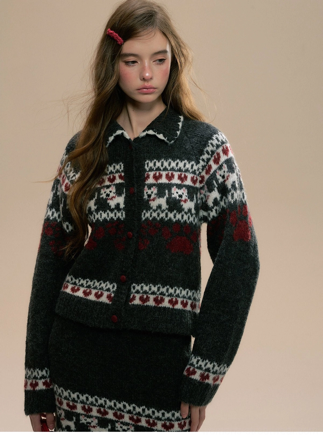 Upper-body view of coordinated Fair Isle knit cardigan and high-waisted mini skirt with matching patterned hems