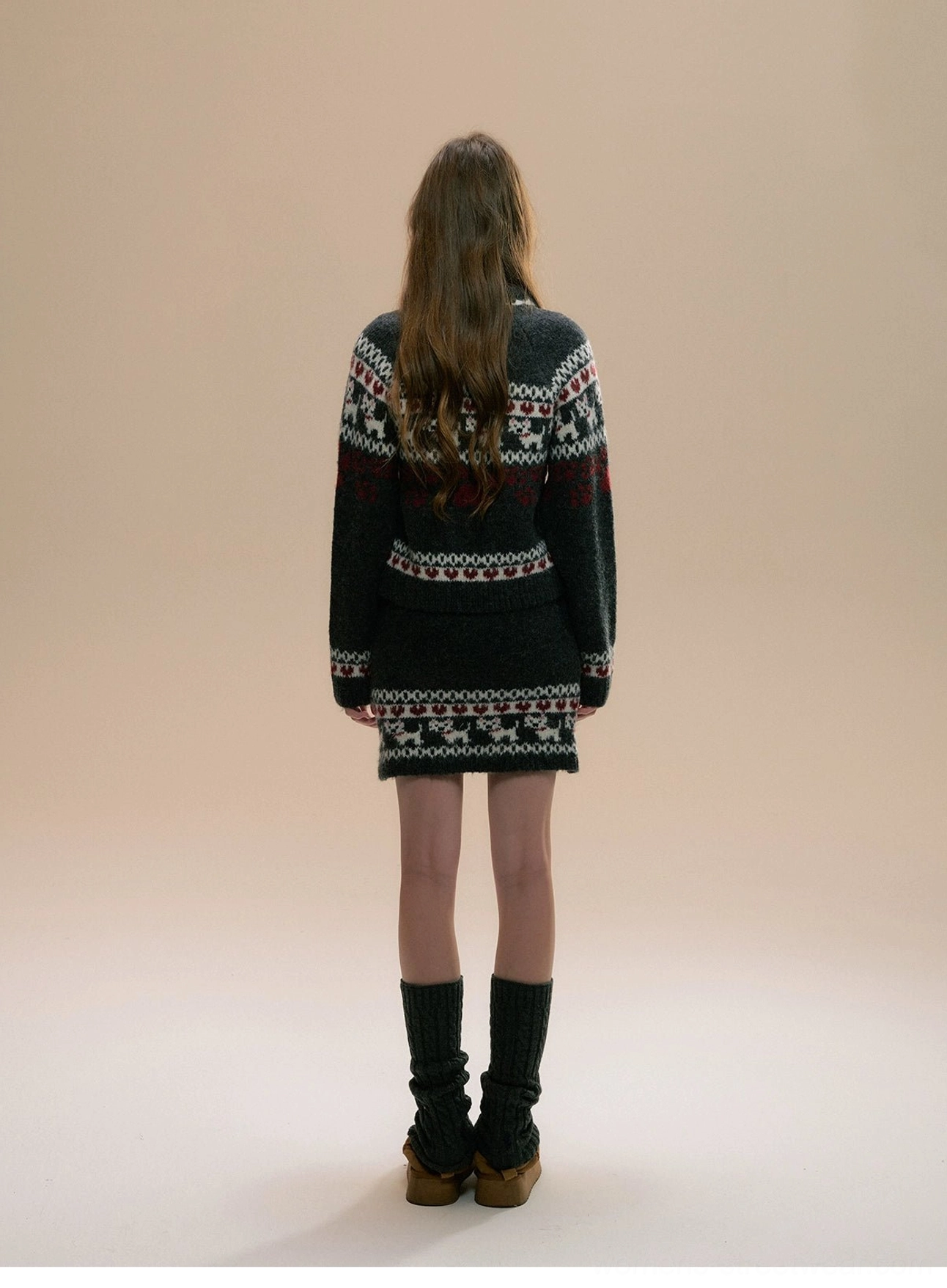Back view of charcoal Fair Isle knit cardigan and matching mini skirt with coordinated winter jacquard patterns
