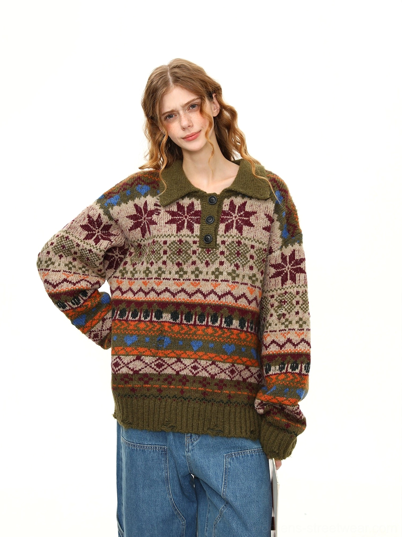 Close-up view of the Fair Isle polo sweater torso showing detailed snowflake, stripe, and geometric knit patterns with ribbed hem and cuffs