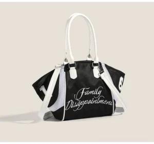 Black Family Disappointment Y2K varsity bowling tote bag with white contrast handles, embroidered slogan, numeral patches, and detachable shoulder strap front view