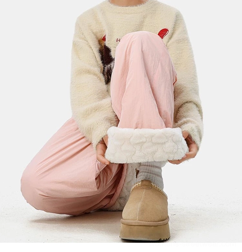 Fashion-forward convertible streetwear trousers with warm fleece lining, textured shell, and relaxed oversized fit