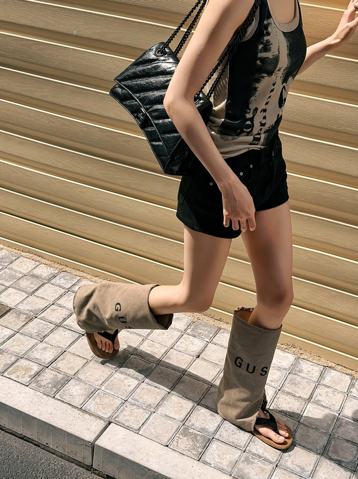 Fashion-forward split-toe suede western sandal boots in khaki with black toe strap and casual mid-calf silhouette
