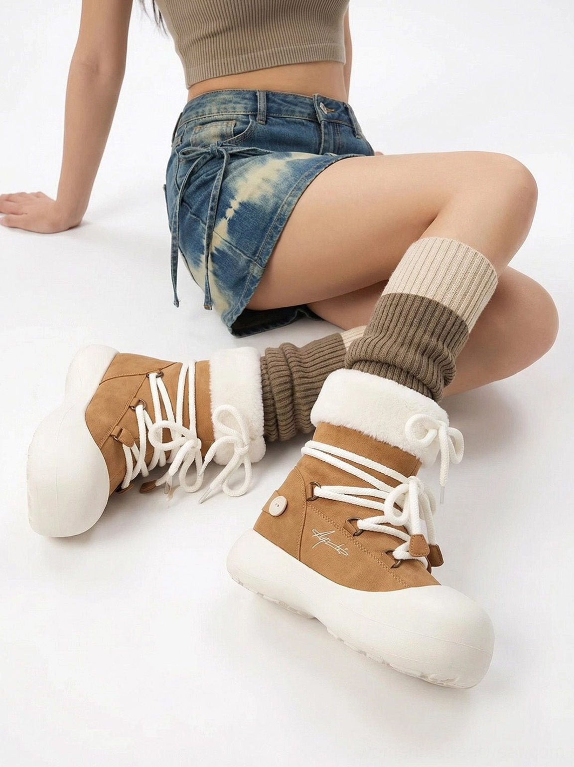 Brown suede-look faux fur cuff platform snow boots front flat lay with white platform outsole