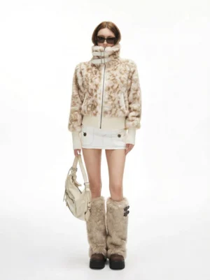 Model wearing faux fur double-buckle platform tall boots with leopard faux fur coat and white shorts streetwear outfit