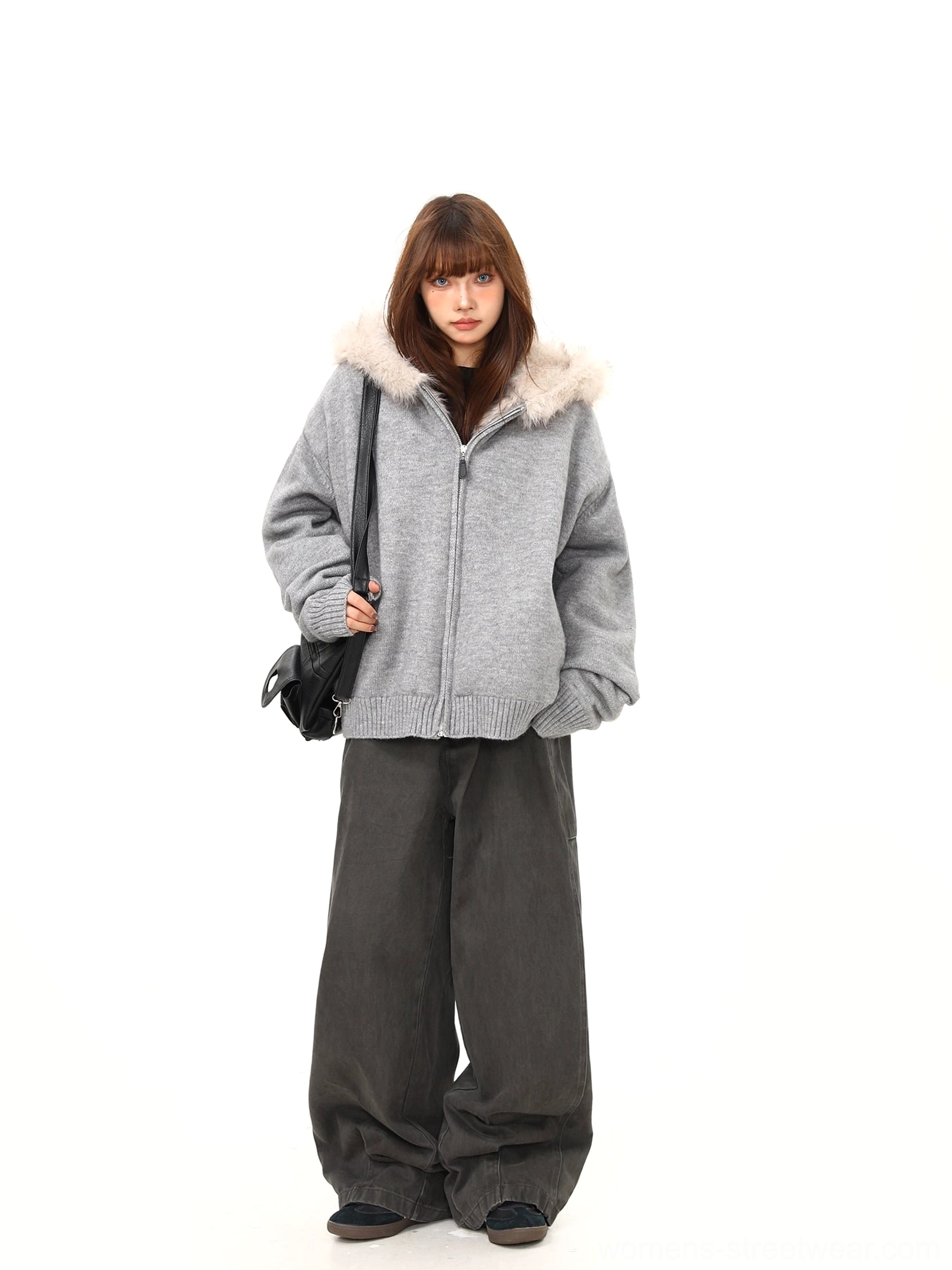 Women's gray oversized faux fur hood knit jacket styled with shoulder bag and wide-leg trousers