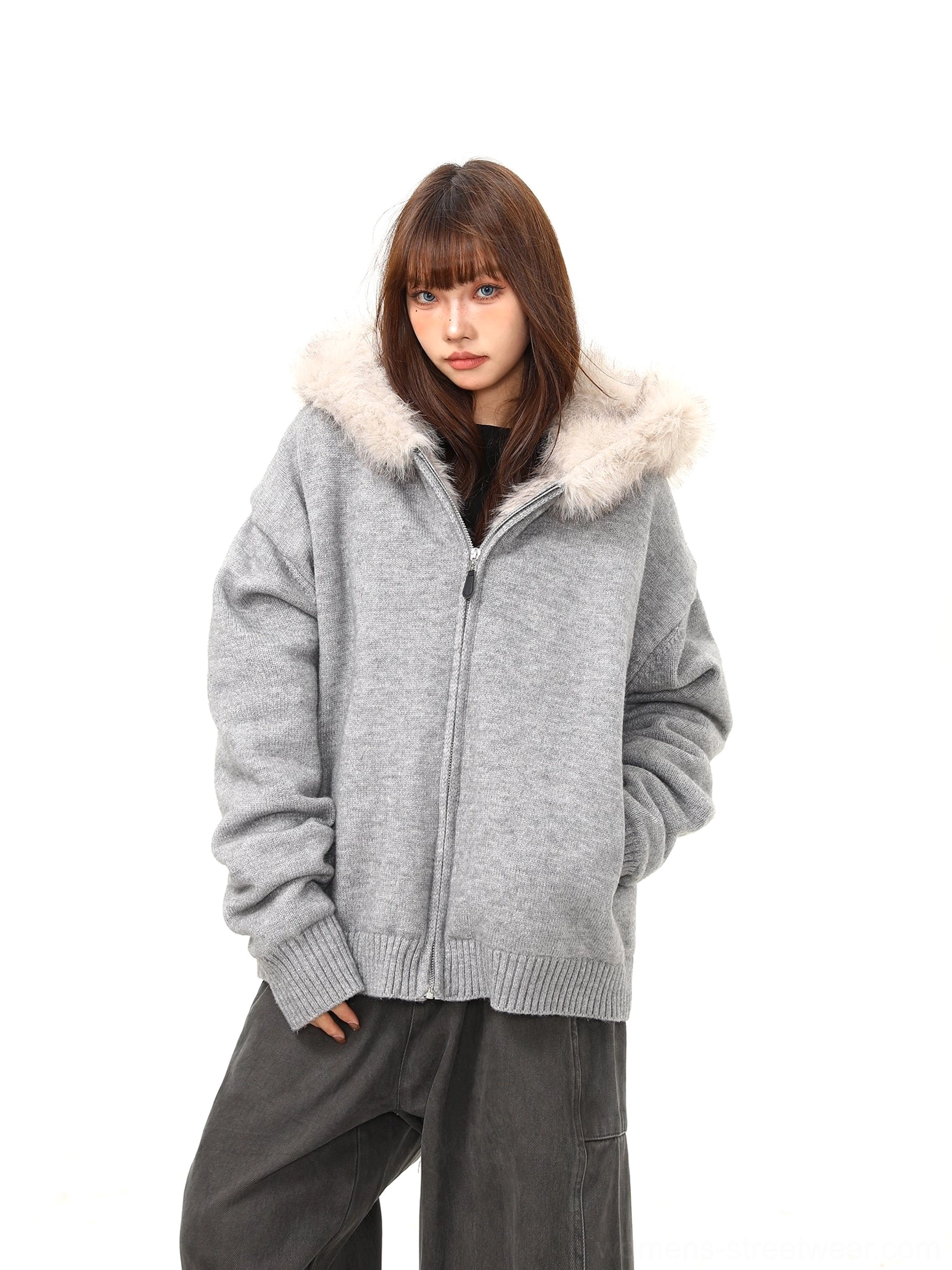 Close front view of women's gray hooded zip-up knit jacket with ribbed hem, cuffs and front pocket