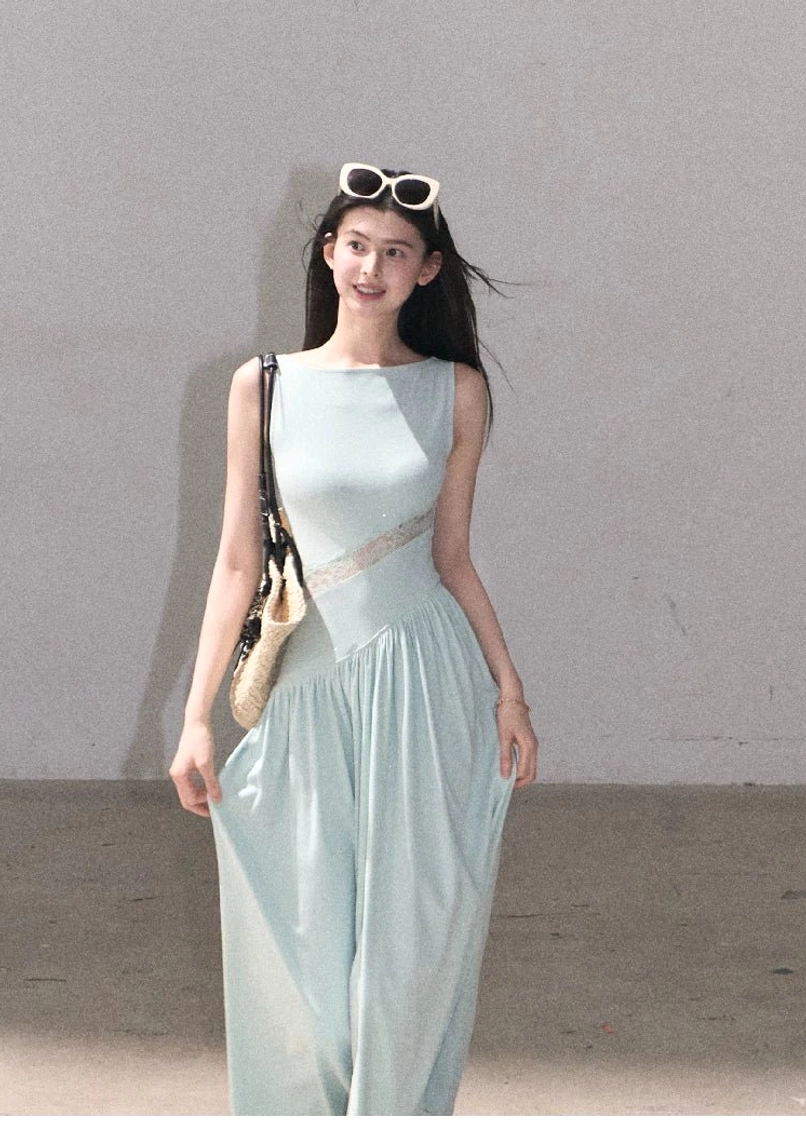 Feminine asymmetrical lace waist dress with sleeveless boat neck and relaxed movement through the skirt