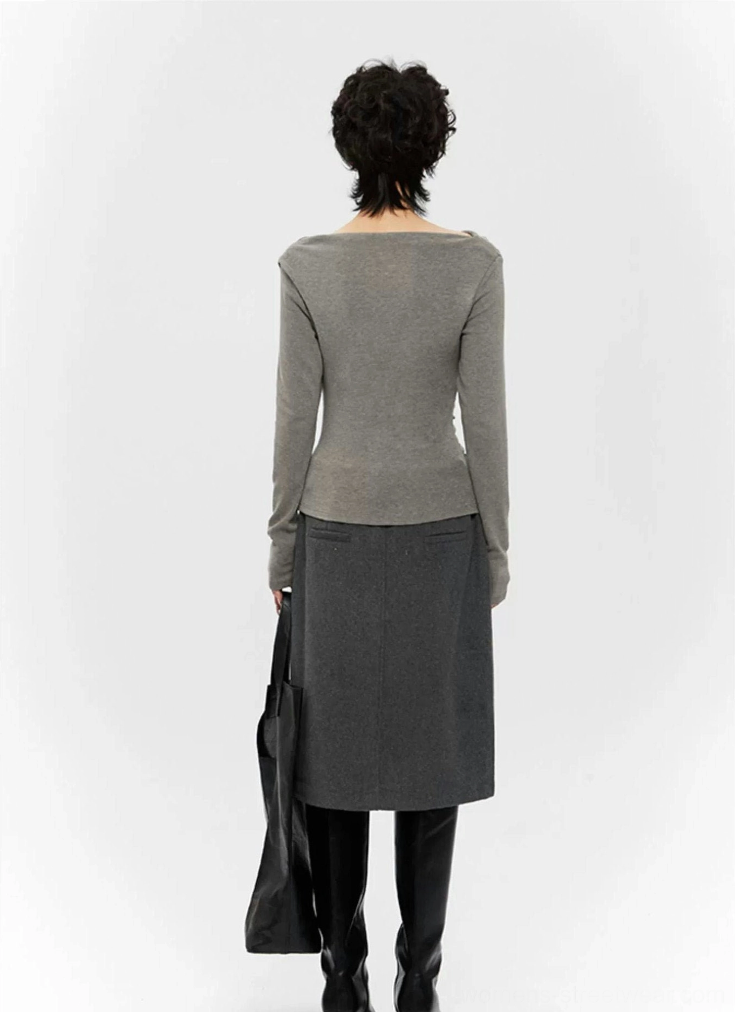 Feminine Y2K streetwear top with draped off-shoulder neckline, ruched texture, and body-skimming silhouette