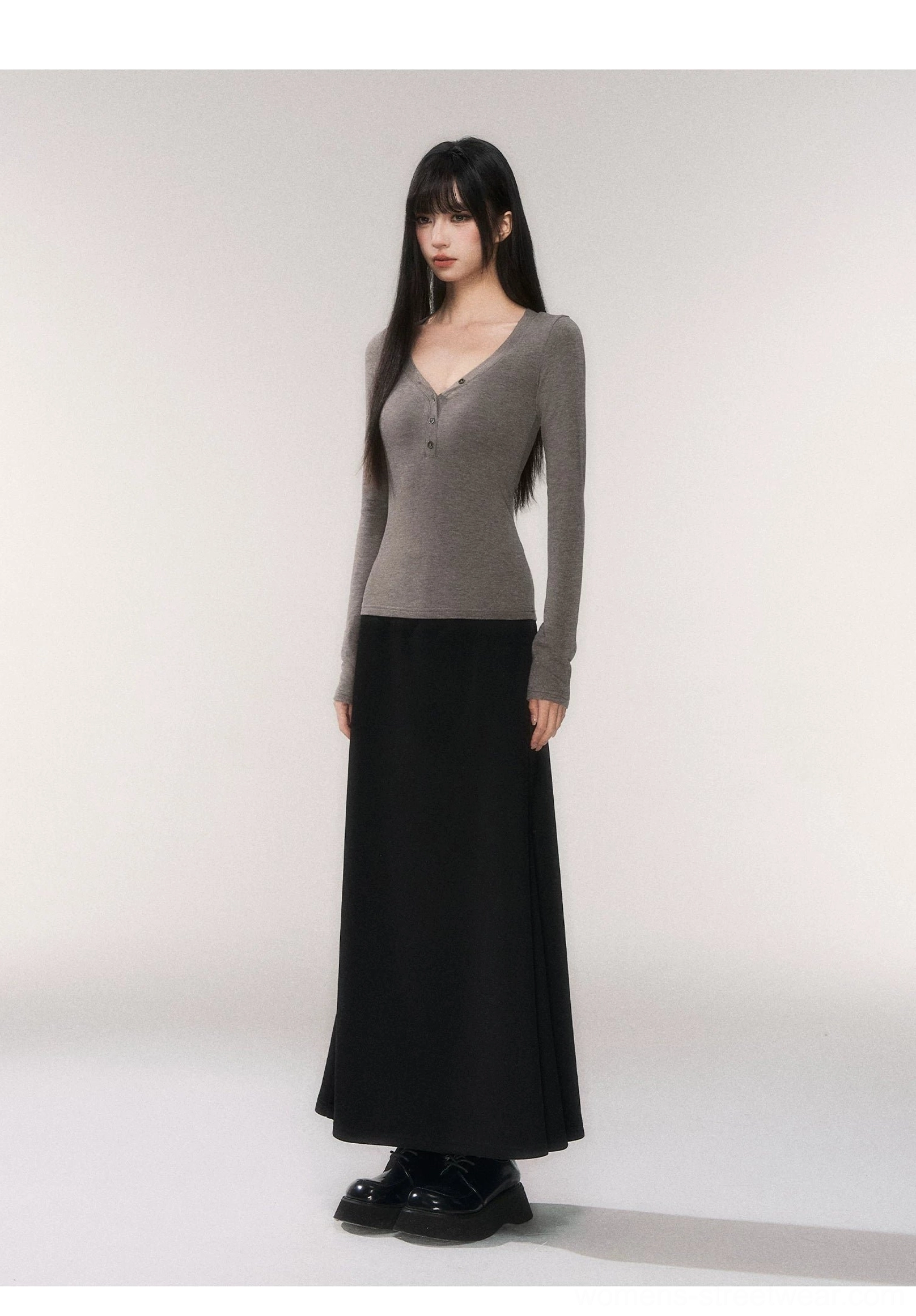 Fitted long sleeve buttoned V-neck knit top with a sleek minimalist silhouette for contemporary Acubi streetwear styling