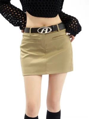 Khaki fitted chino mini skirt with front pockets, black A-buckle belt, black cropped knit top, and knee-high socks in a Y2K streetwear outfit