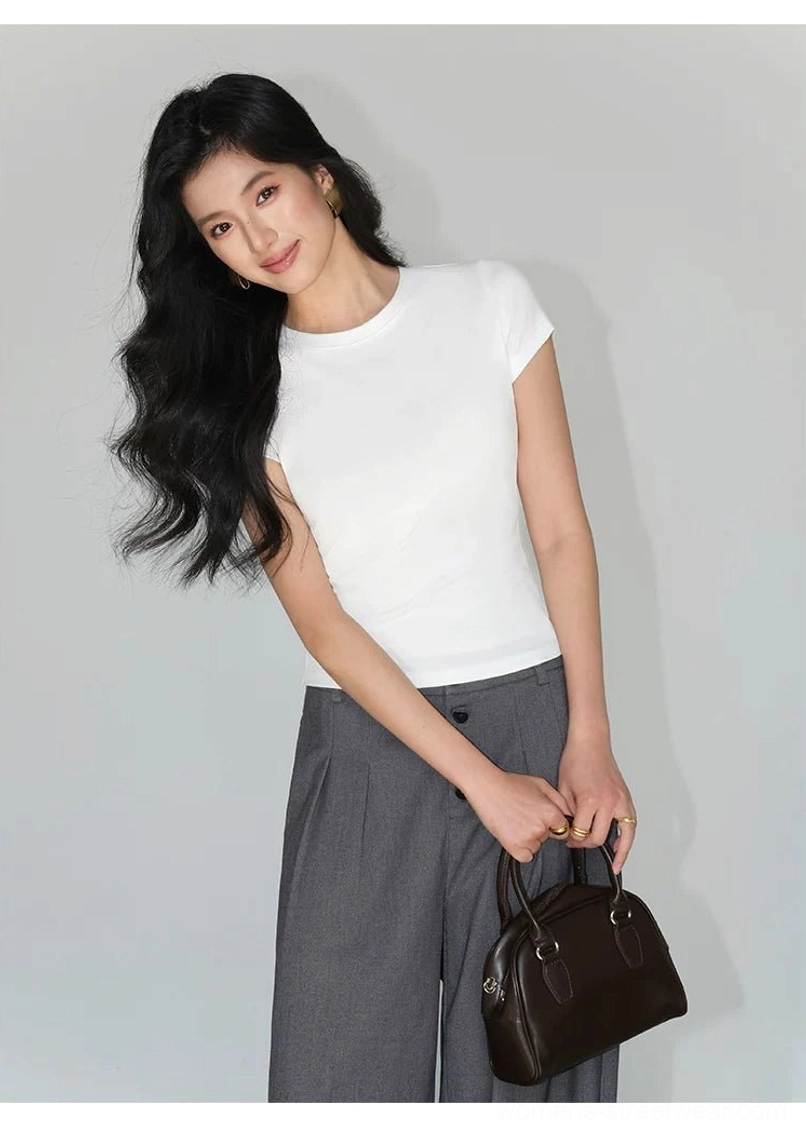 fitted crew neck black t-shirt side angle view body hugging silhouette contemporary streetwear essential
