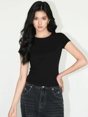 fitted crew neck black t-shirt front full body view minimalist streetwear tee with dark vintage jeans casual styling