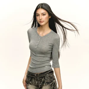 Heather grey fitted ribbed Henley top with front button placket and half sleeves styled with vintage studded jeans