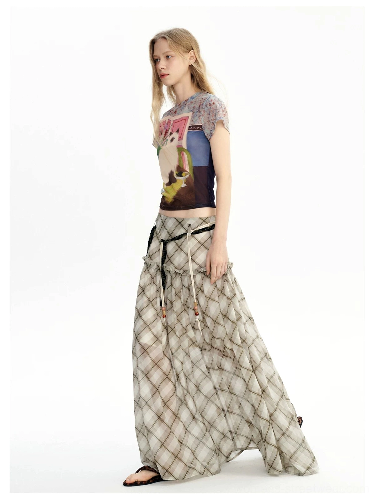 Full-length side profile of a floor-grazing neutral plaid chiffon maxi skirt with lightweight flowing fabric