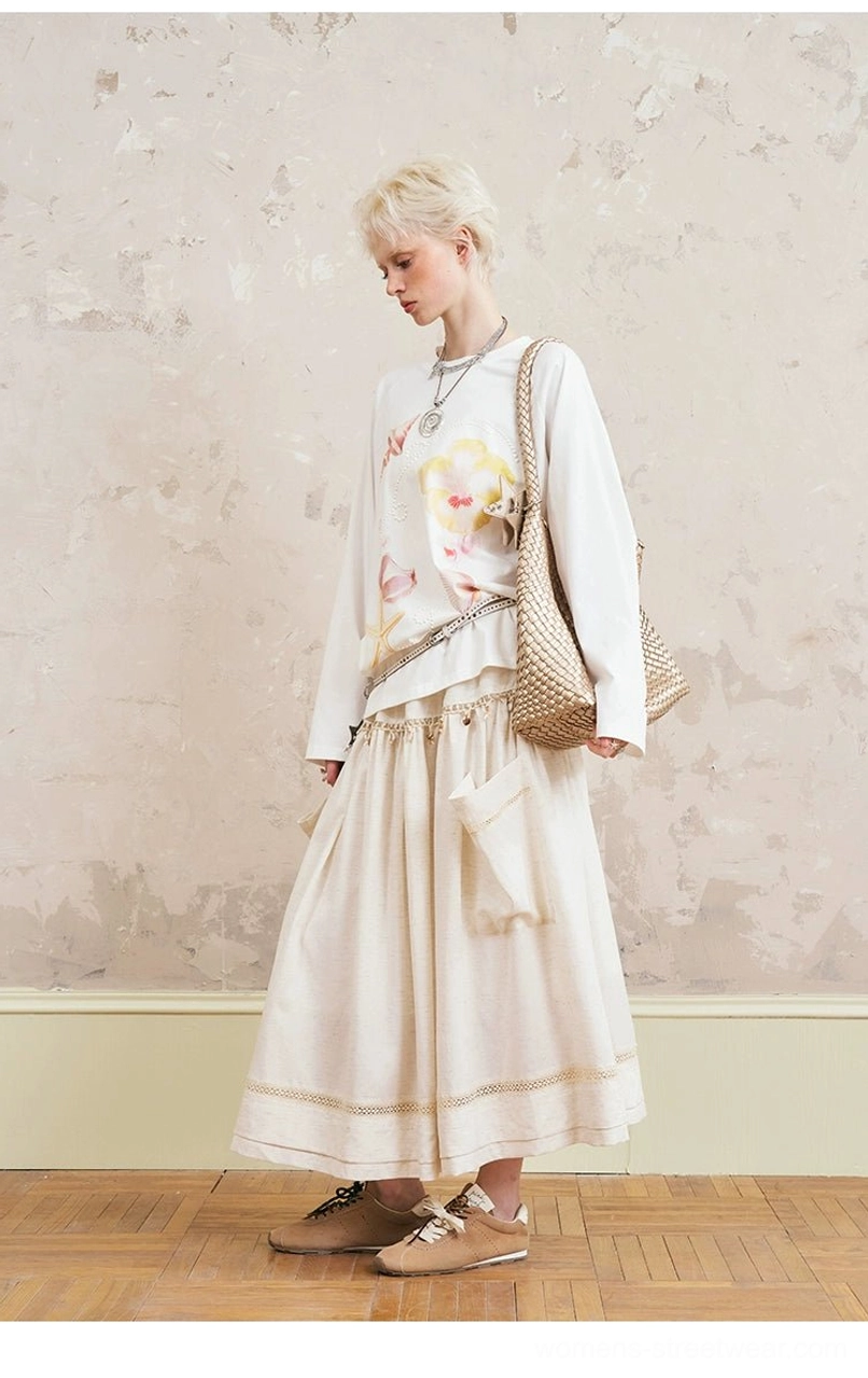 Side profile view of floral sweatshirt with flowing midi skirt - showing relaxed fit and skirt movement