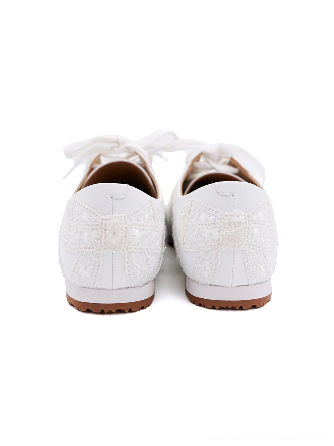 Floral lace microfiber leather low-profile sneakers featuring a retro slim sole and decorative heel bows