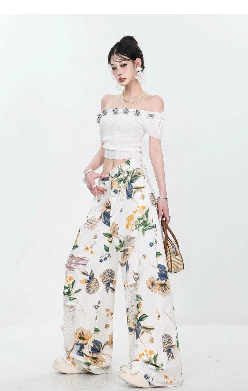 Statement floral print distressed jeans with a loose wide-leg silhouette for Y2K streetwear outfits