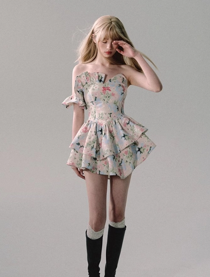 Floral ruffle mini dress fashion product view with watercolor flower print, fitted corset bodice, sweetheart neckline, and playful layered skirt