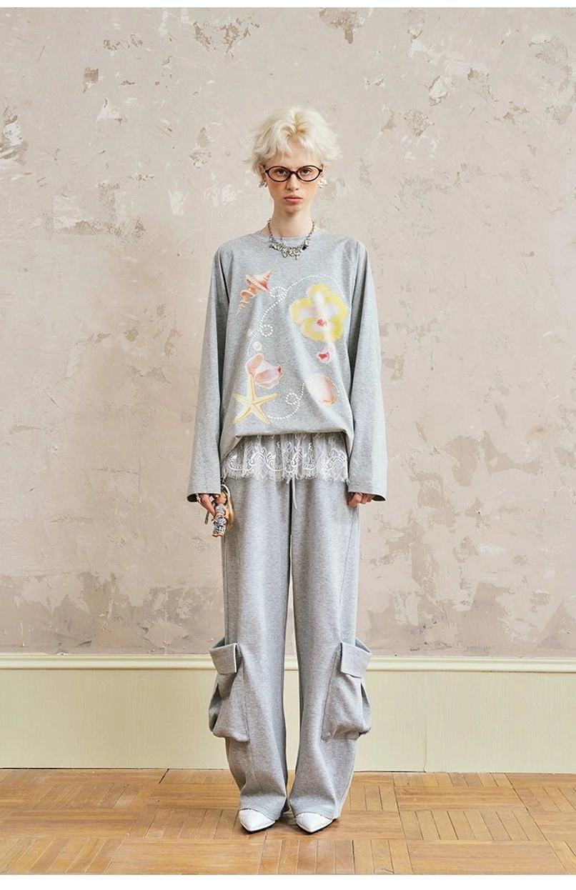 Watercolor floral printed oversized sweatshirt with gray cargo sweatpants - relaxed fit streetwear set full body view