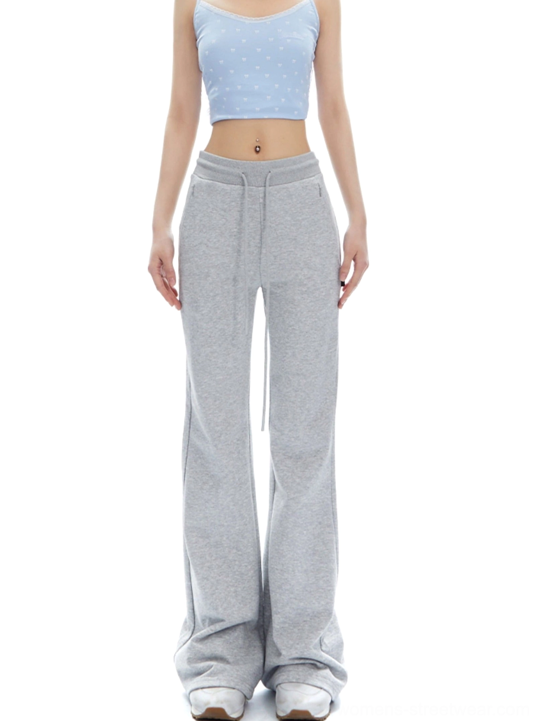 Flower Ash high-waist sweatpants with flared legs, drawstring waist, and front pockets shown in a full-body fashion view