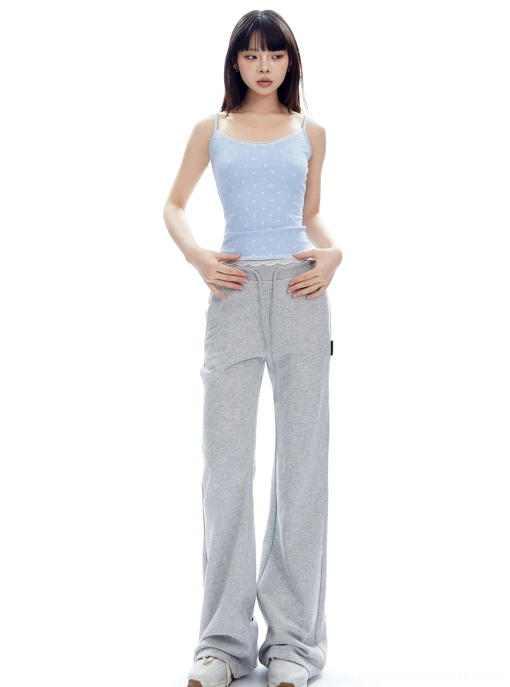Flower Ash high-waist flared sweatpants featuring a layered waistband design and long floor-length streetwear silhouette