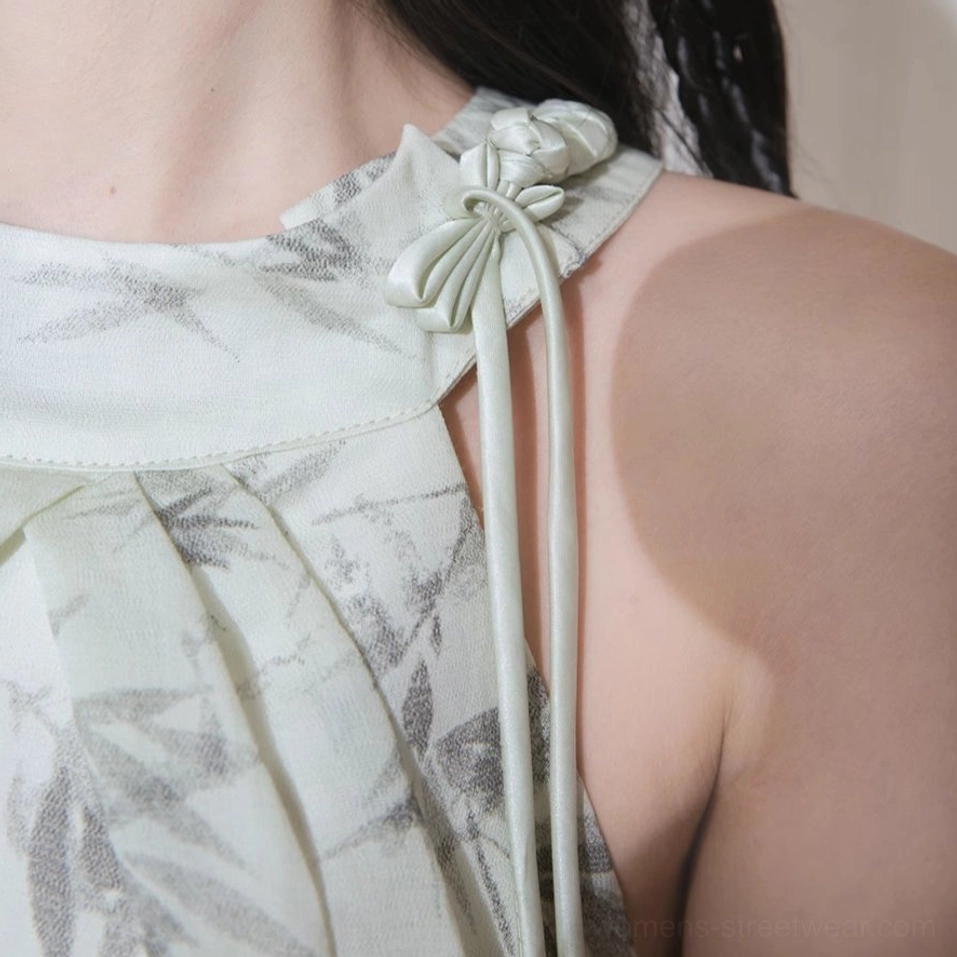 Flowing asymmetric ruffle hem dress with ink wash bamboo pattern and elegant open back halter styling