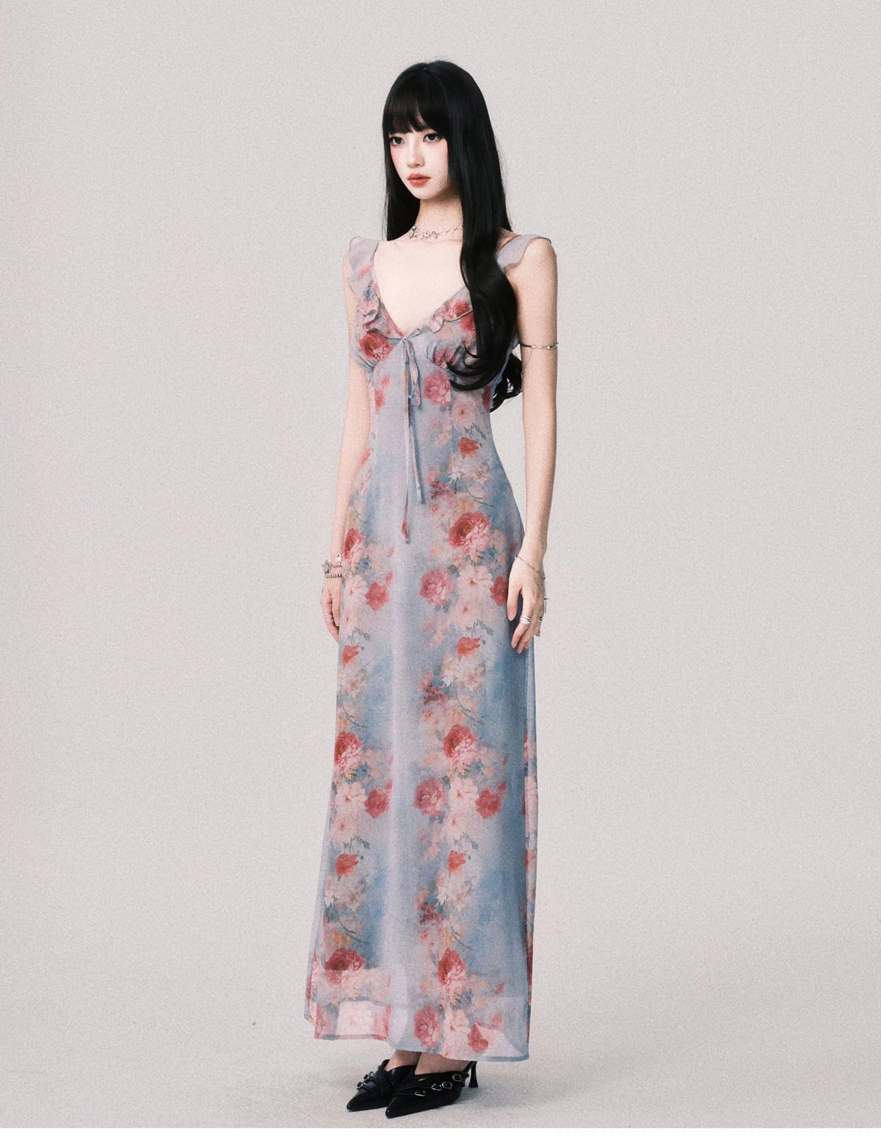 Foggy blue vintage floral maxi dress shown from a three-quarter side angle with fitted waist flowing skirt and romantic rose print