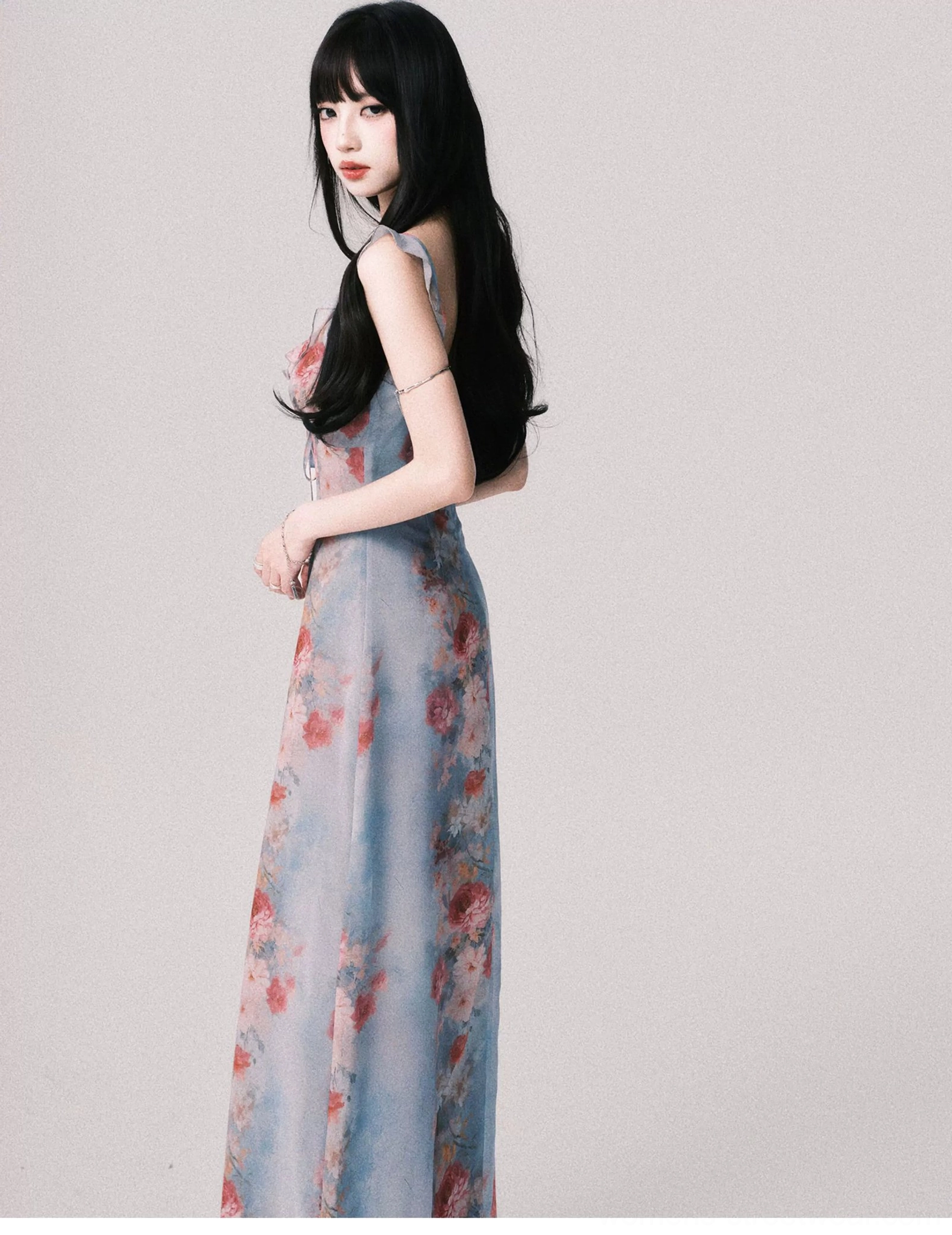 Foggy blue vintage rose floral maxi dress shown in a full side view with slim waist and softly flowing floor length skirt