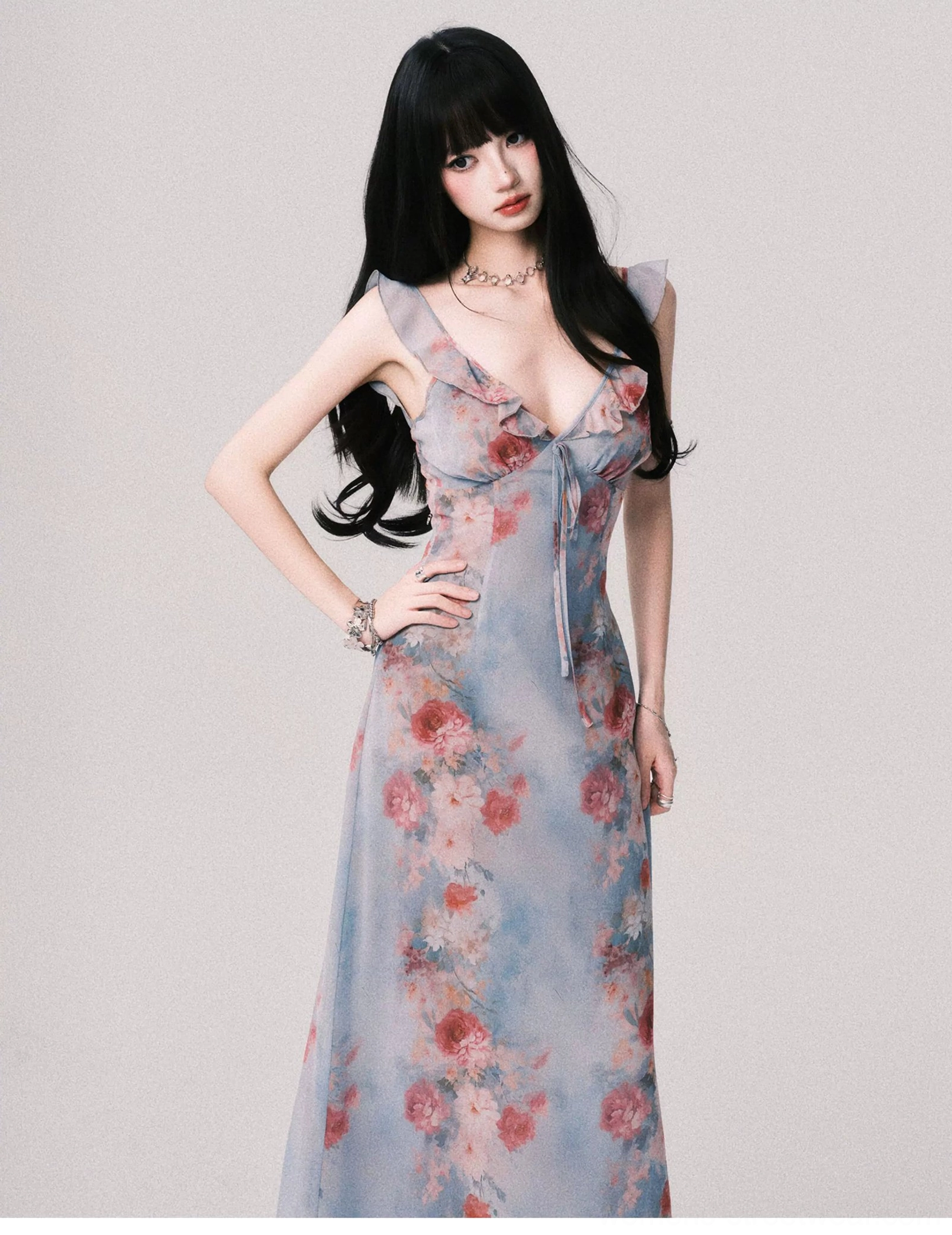 Foggy blue Y2K floral maxi dress shown from the side with fitted bodice ruffled straps and flowing floor length silhouette