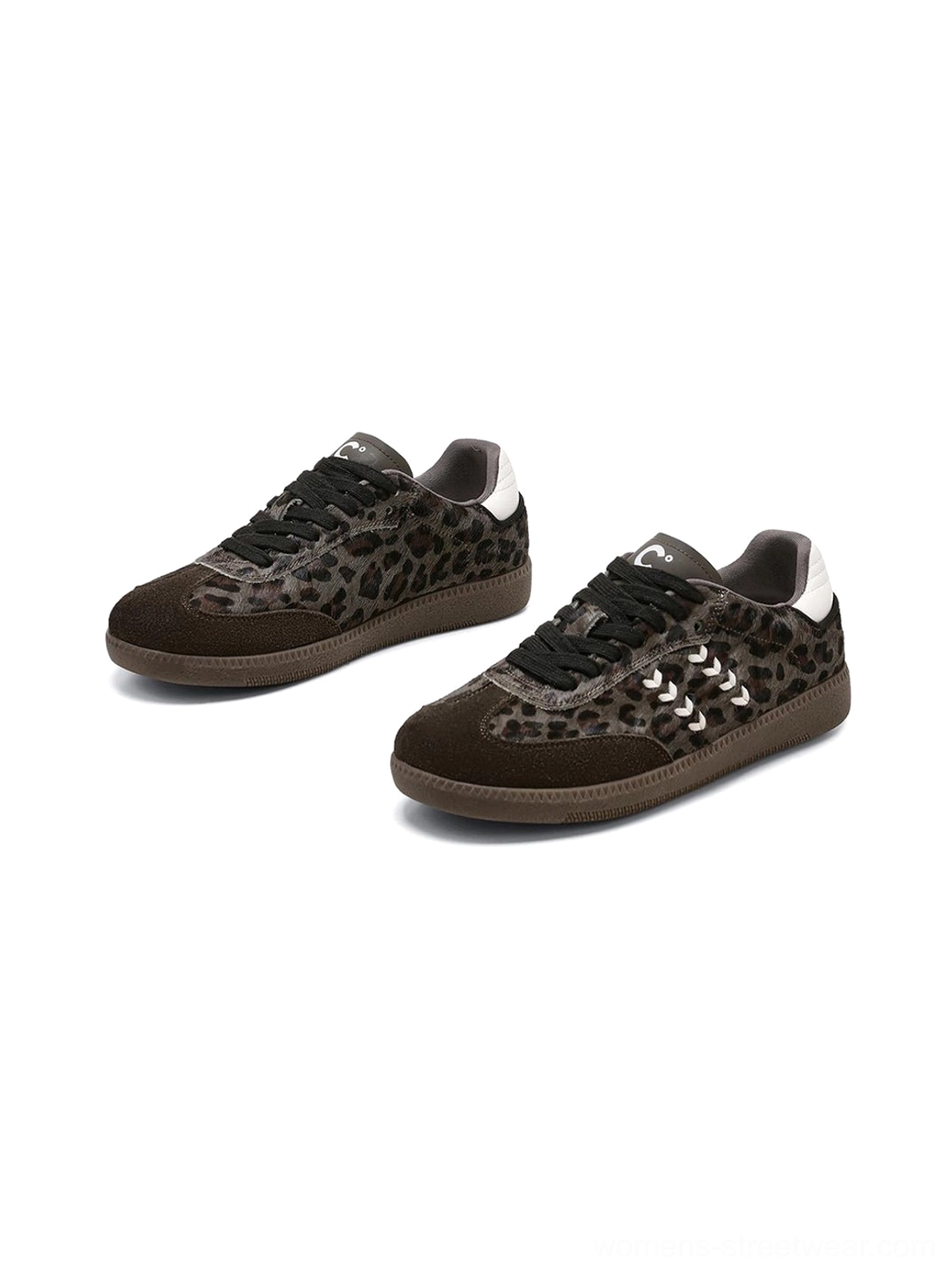 Angled flat lay of forest leopard print low top sneakers showing the textured upper, front laces, white stitching, heel tabs, and brown gum rubber outsole