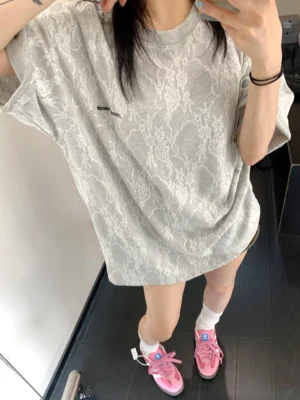 Grey lace texture oversized streetwear t-shirt with dropped shoulders and rolled sleeves shown from the front